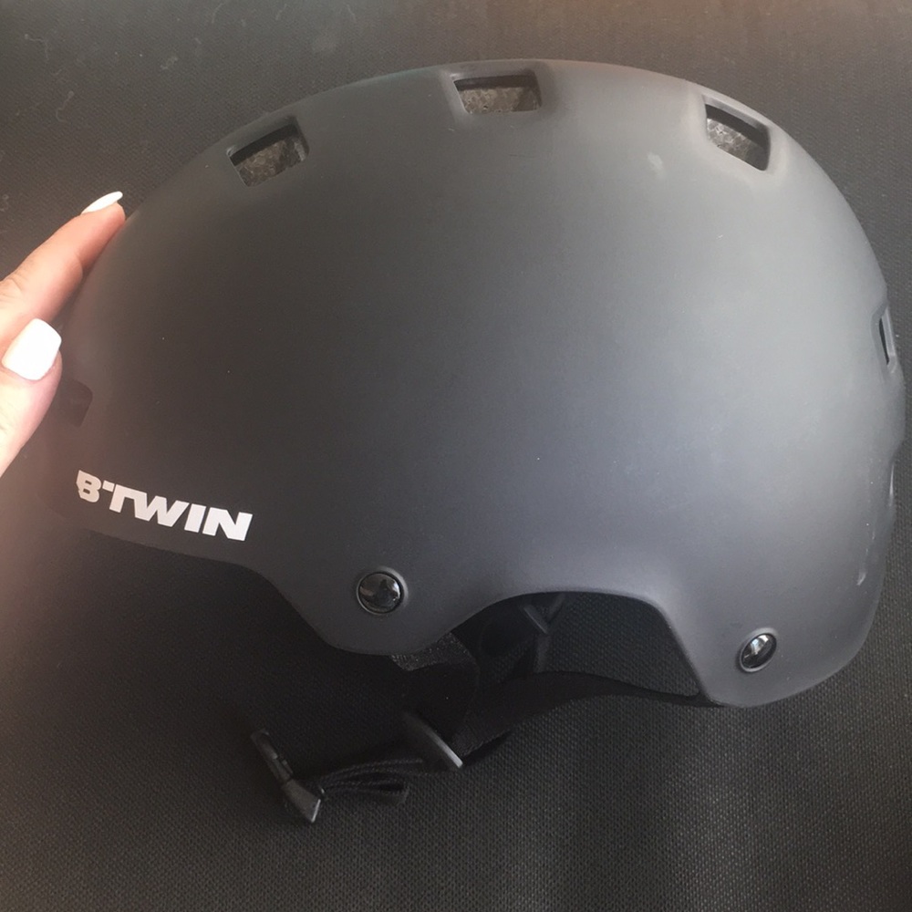Black helmet for biking, skating, long boarding.